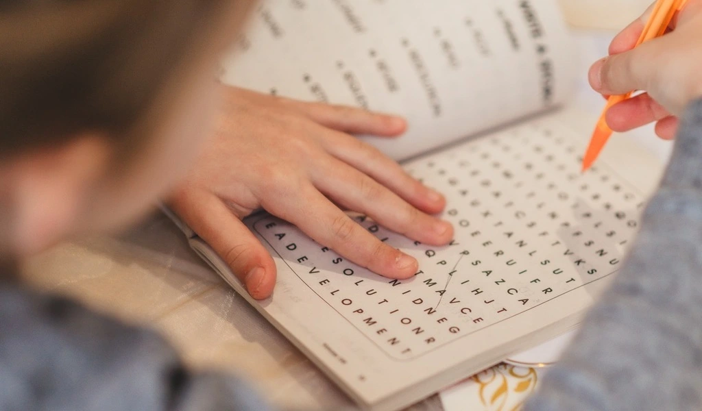 A child playing a Word Search